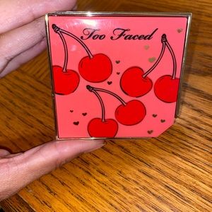 Too faced fruit cocktail blush duo in the shade “cherry bomb”.